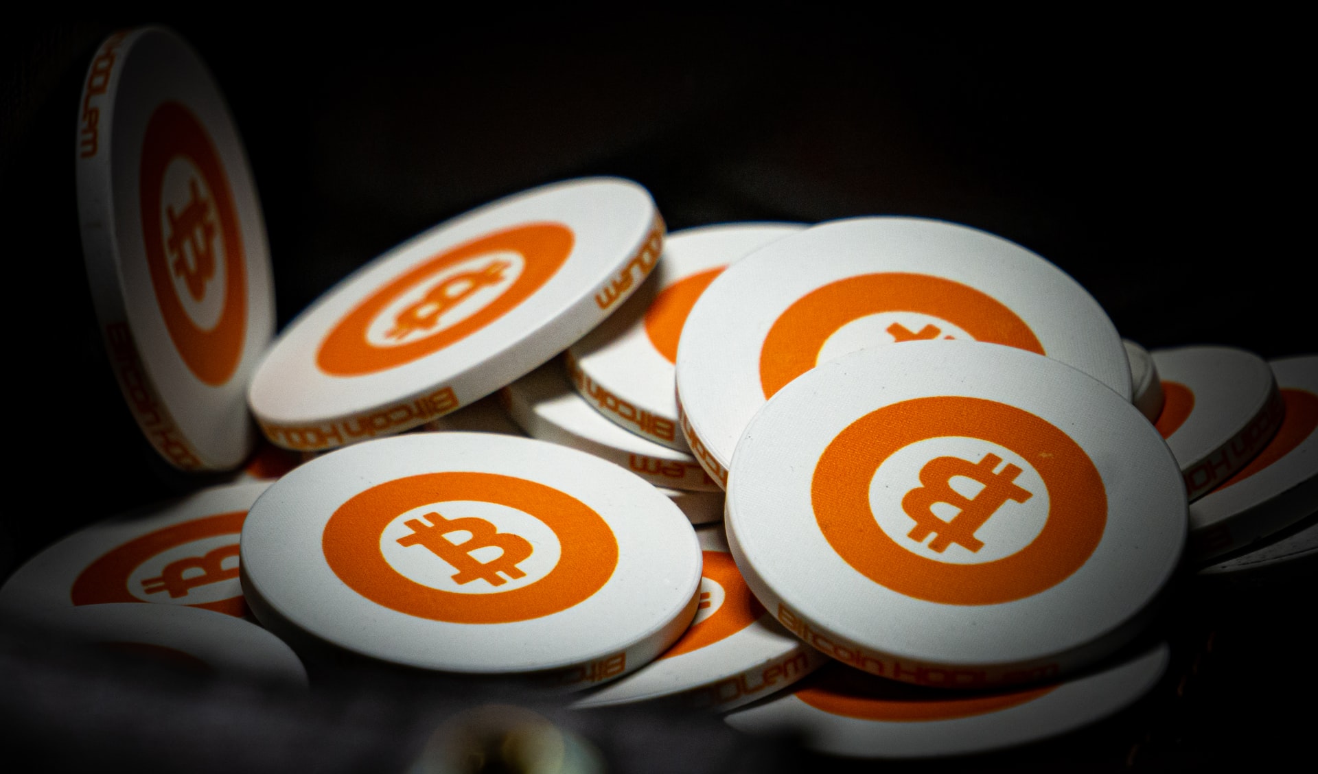 An image of white and orange bitcoins