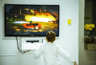 A kid watching TV