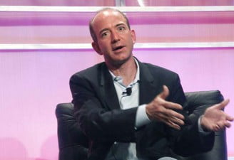 Jeff Bezos talking to a media personal during an interview