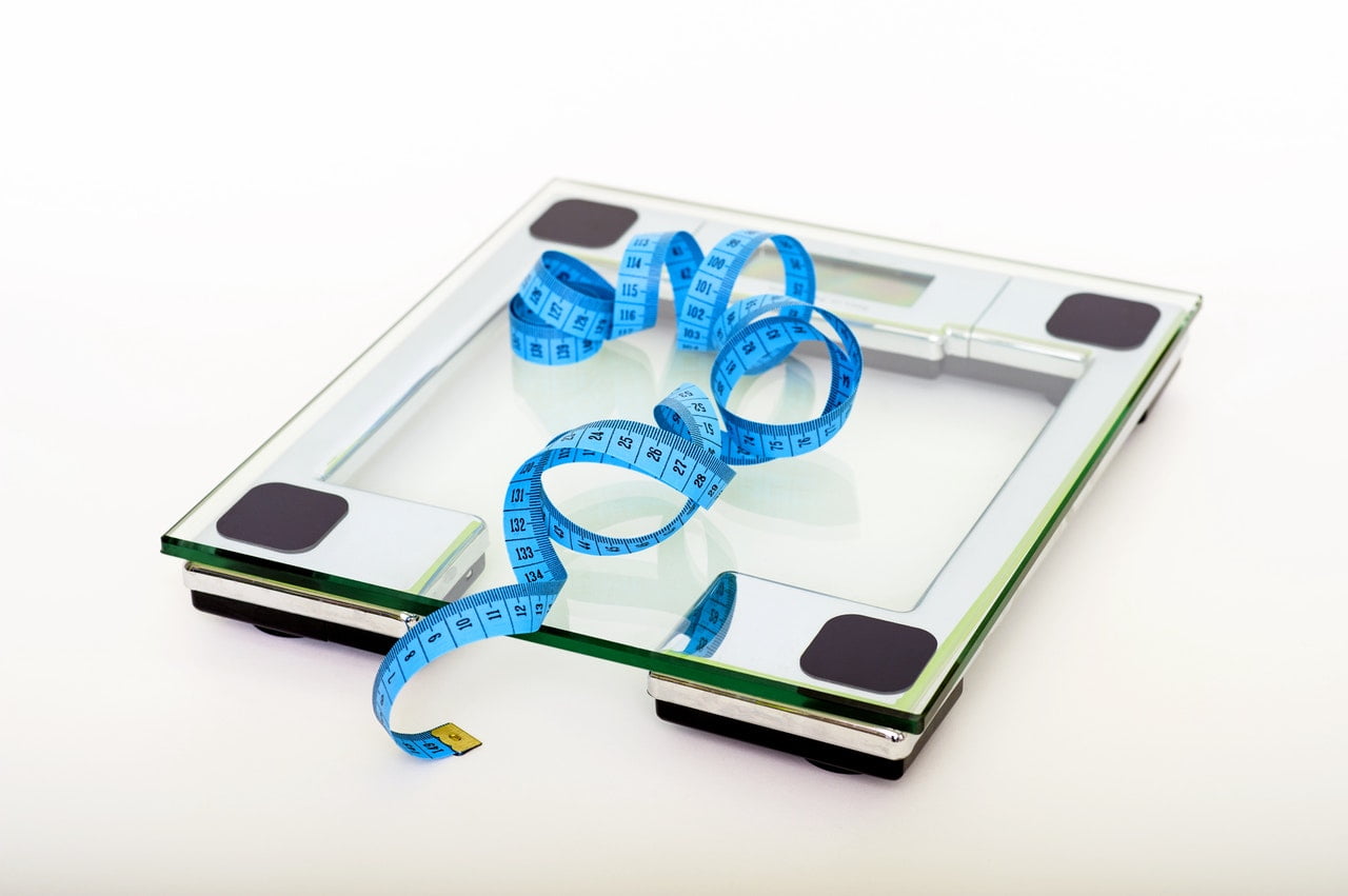 An Image Showing A Measurement Tape On Top Of A Glass