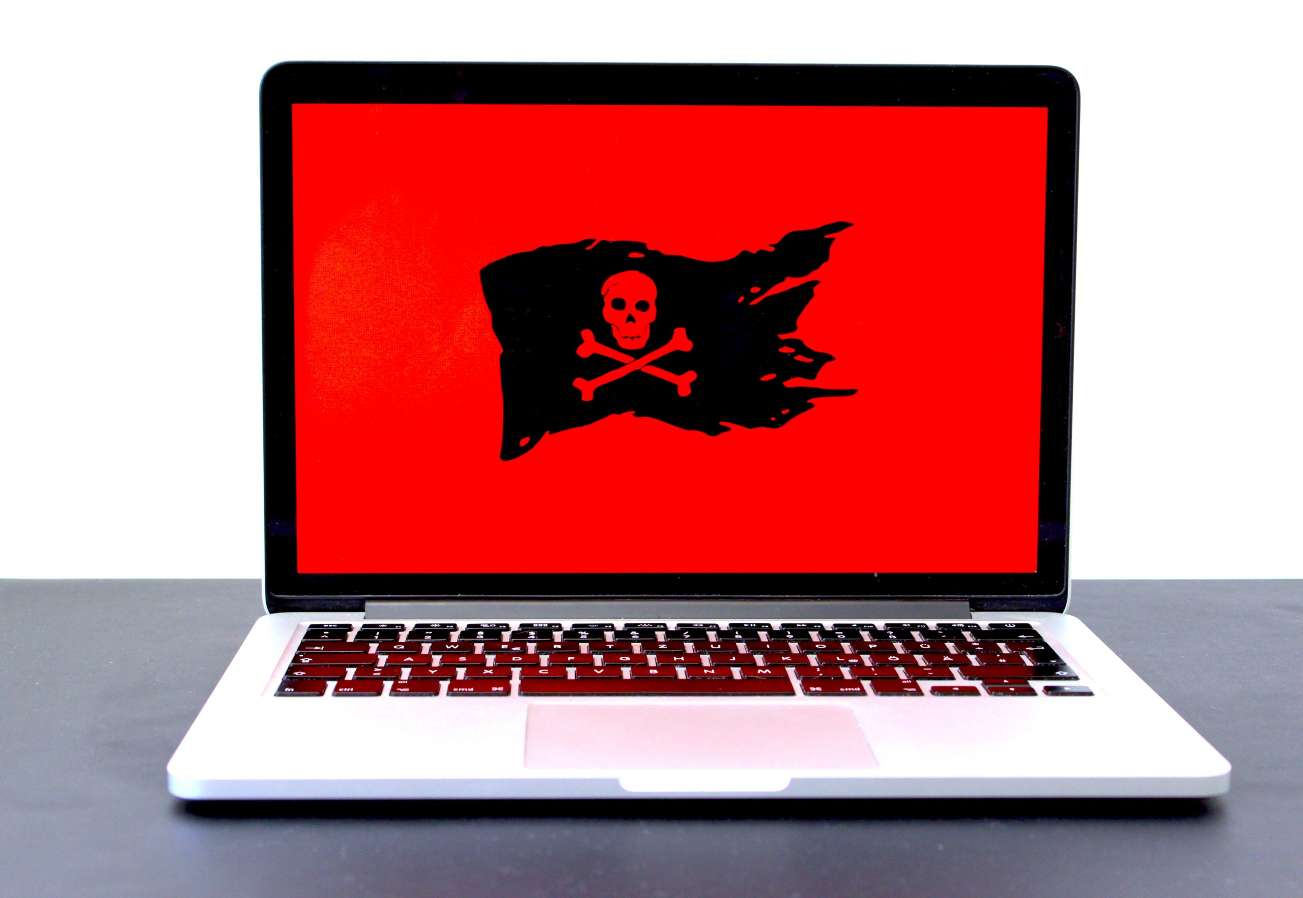 Photo of a laptop with pirate sign